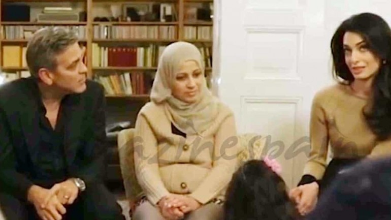 George Clooney y su esposa Amal, con los refugiados sirios